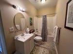 Lower Level Bathroom with a tub shower combo